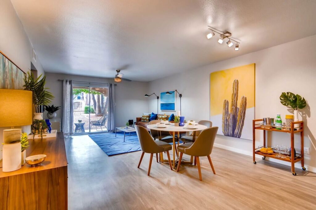 Open dining and living area with glass doors to the patio