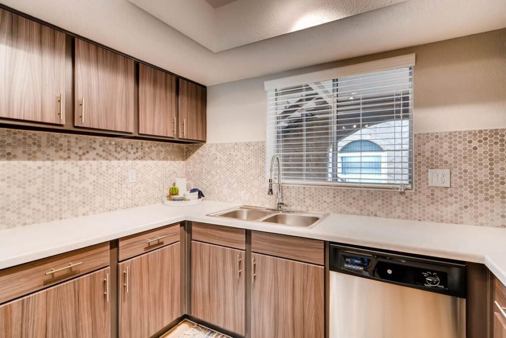 Kitchen with white countertops and and tile backsplash