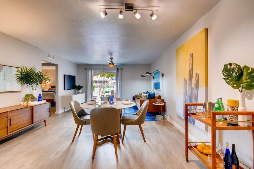 Open dining and living area with large windows