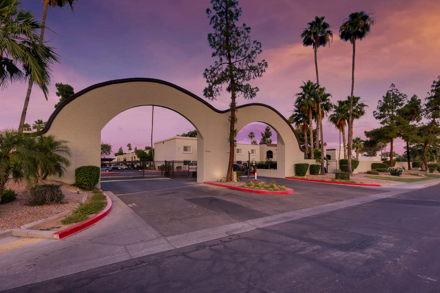 Entrance to the Complex with arches and palm trees